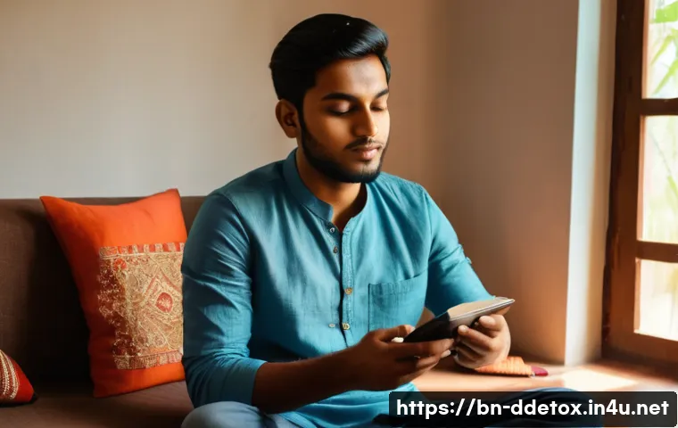 디지털디톡스와 청소년들에게 주는 영향 - A young Bengali man sitting peacefully in a cozy, sunlit room, gently putting away his smartphone to...