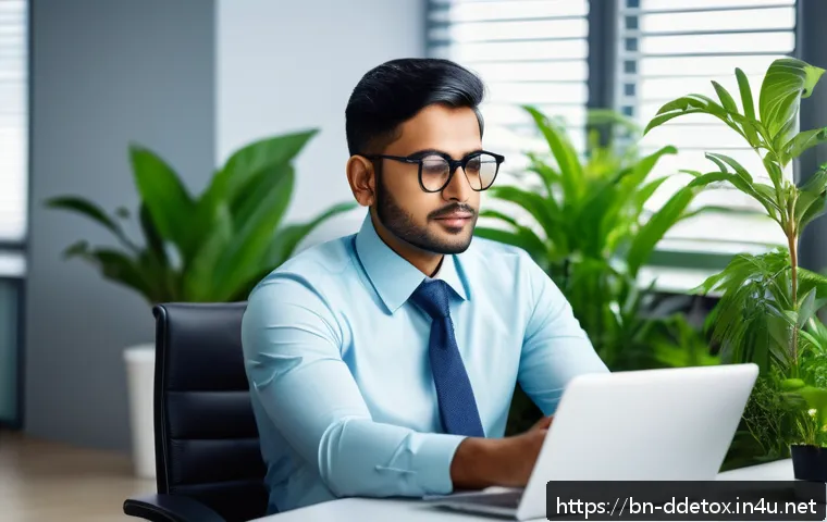 디지털디톡스와 직장 내 효율성 - A professional Bengali office worker taking a short break from computer work, sitting comfortably in...